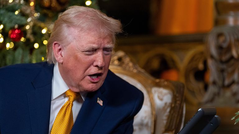 Trump at his Mar-a-Lago club on Christmas Eve. Pic: AP