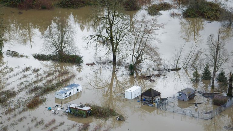 'Catastrophic', life-threatening, floods hitting Washington State, USA 6 A property with a mobile home is flooded by the Snoqualmie River. Pic: The Seattle Times/AP