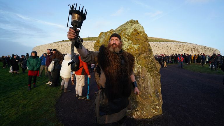 A person dressed as 'An Gobha', the Blacksmith of the Boyne Valley, at Newgrange. Pic: PA