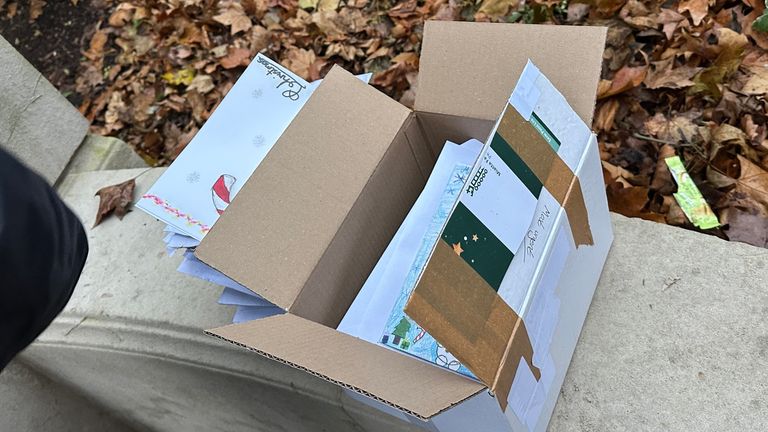 The container  of Christmas cards was conscionable  extracurricular  the parliamentary estate.