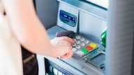 A file picture of a women withdrawing cash from an atm. Pic: iSock