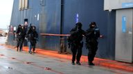 Counterterrorism police carry out their operation on the ferry