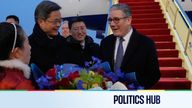 Britain's Prime Minister Keir Starmer receives a bouquet of flowers at an airport in Beijing, China, Wednesday, Jan. 28, 2026. (AP Photo/Kin