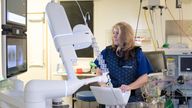 EMBARGOED TO 0001 TUESDAY JANUARY 27 Thoracic surgeon Stephanie Fraser demonstrates AI and robot technology being used by NHS England (NHSE)