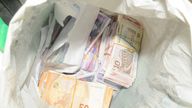 Money found at the cottage raided by police