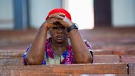 A woman prays during at a church in Minna, Nigeria, after a mass kidnapping last year. File pic: Reuters