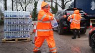 South East Water staff hand out bottled water at a water station in Maidstone on 13 January. Pic: PA