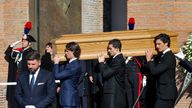 Anthony Souza, the godson of late fashion designer Valentino Garavani, and pallbearers carry the coffin of Valentino Garavani, who died at t