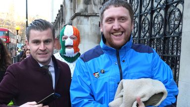 The band's lawyer Darragh Mackin (left), and manager Daniel Lambert (right), with DJ Provi outside the High Court. Photo: PA