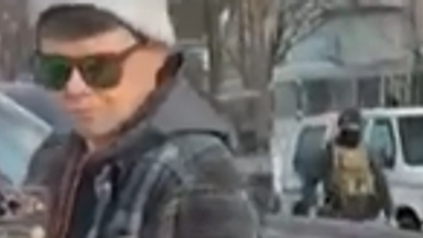 Another ICE agent is seen approaching the vehicle, saying