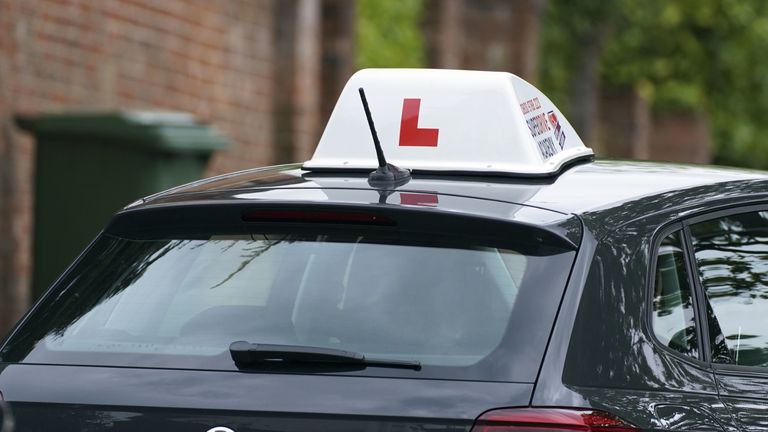 A learner driver drives down a street in Winchester, Hampshire. Picture date: Thursday May 20, 2021.