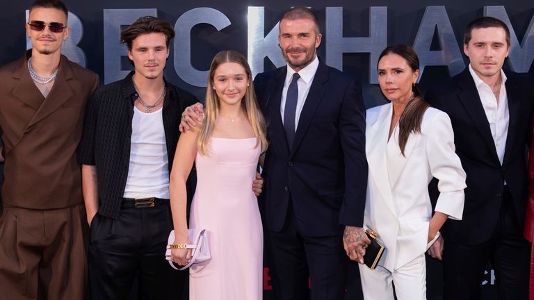 The Beckhams, left to right: Mia Regan, Romeo, Cruz, Harper, David, Victoria, Brooklyn and Nicola Peltz, at a 2023 London premier. Pic: AP