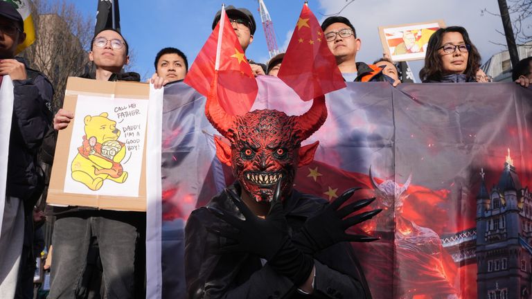 Representatives from the Inter-Parliamentary Alliance on China and other China critics demonstrate outside Royal Mint Court. Pic: PA.