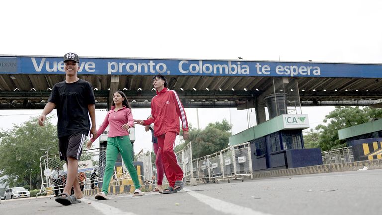 People walk near the Venezuela-Colombia border. Pic Reuters