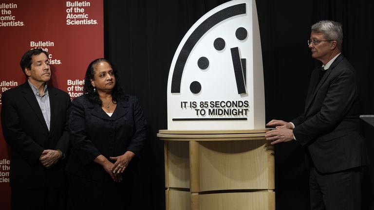 Bulletin members Jon B. Wolfsthal (left), Asha M. George (centre) and Steve Fetter (right) reveal the clock. Pic: AP