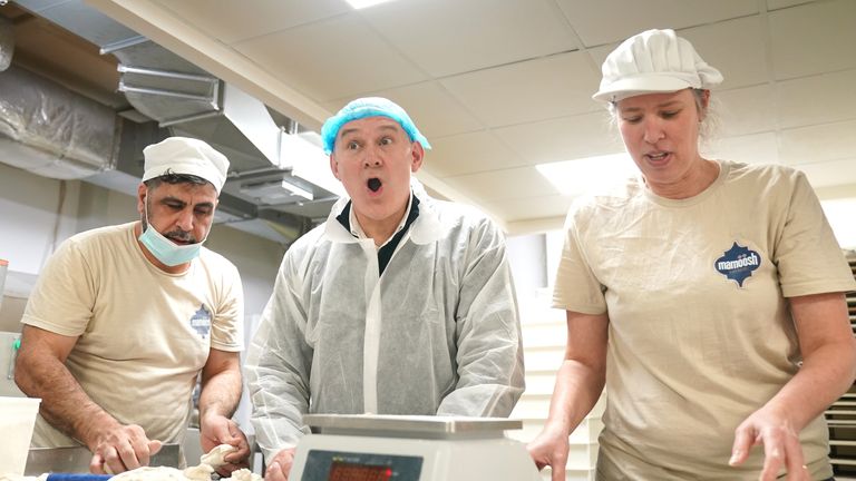 Sir Ed learning how to make pitta bread at a bakery in Sussex. Pic: PA
