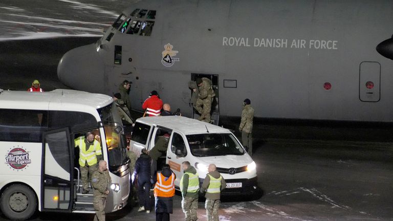 A Royal Danish Air Force plane carrying soldiers lands at Nuuk airport Greenland in January. Pics: Reuters