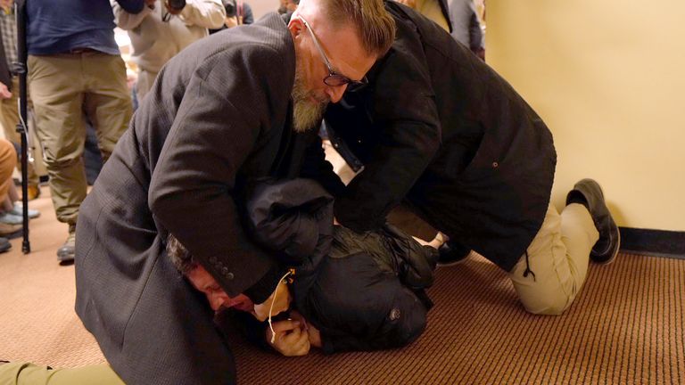 The man was wrestled to the ground. Pic: AP