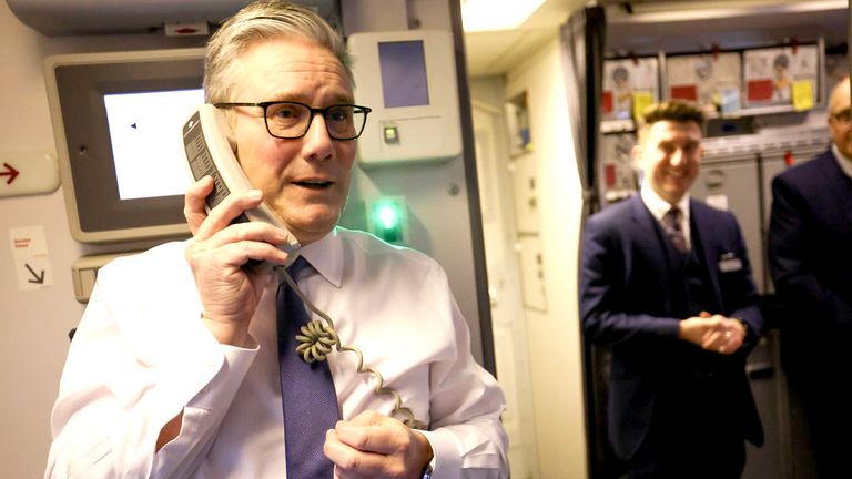 Keir Starmer makes a tannoy announcement to members of the delegation as he arrives in China.
Pic: Simon Dawson / No 10 Downing Street