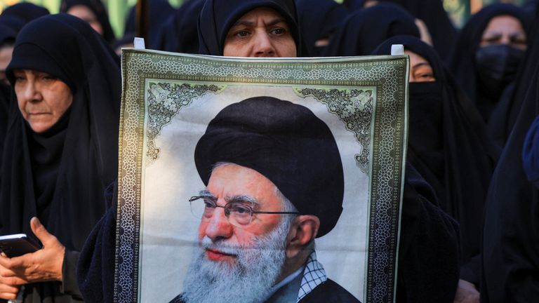 A Khamenei supporter during a pro-government rally in Tehran. Pic: Reuters 