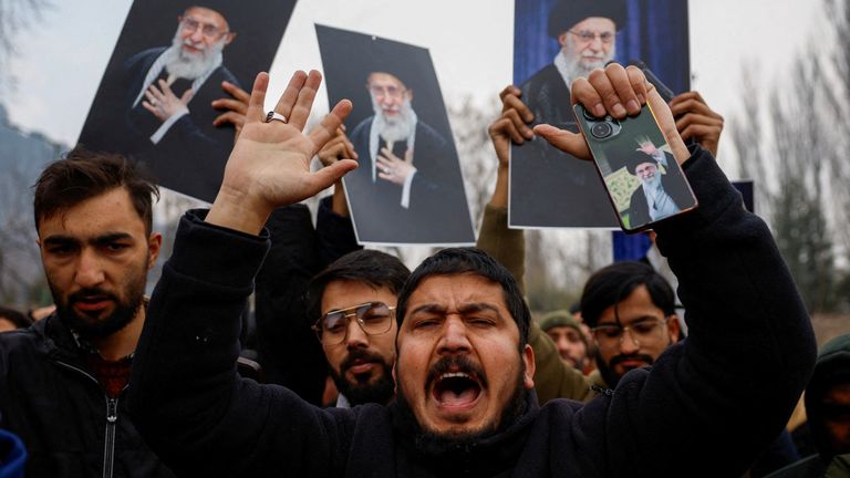 Kashmiri Shi'ite Muslims brandishing pictures of Khamenei at a pro-Iran rally. Pic: Reuters
