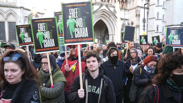 Supporters of the Irish rap group Kneecap outside the High Court. Pic: PA