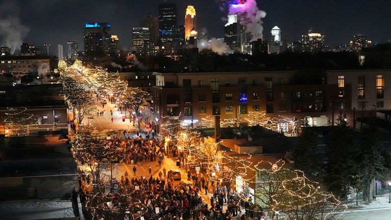 People gather in Minneapolis during a vigil for Mr Pretti. PIc: AP Photo/Adam Gray