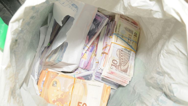 Money found at the cottage raided by police. Pic: Greater Manchester Police