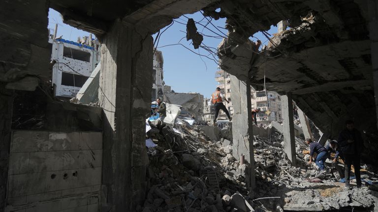 Palestinians search for bodies and survivors from the rubble of the hit police station. Pic: AP