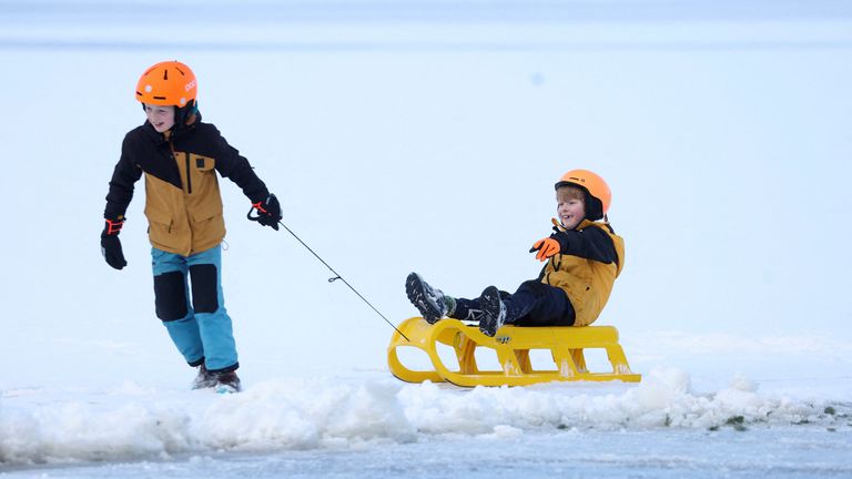 Bode and Reilly play on the frozen Loch Insh near Aviemore. Pic: Reuters
