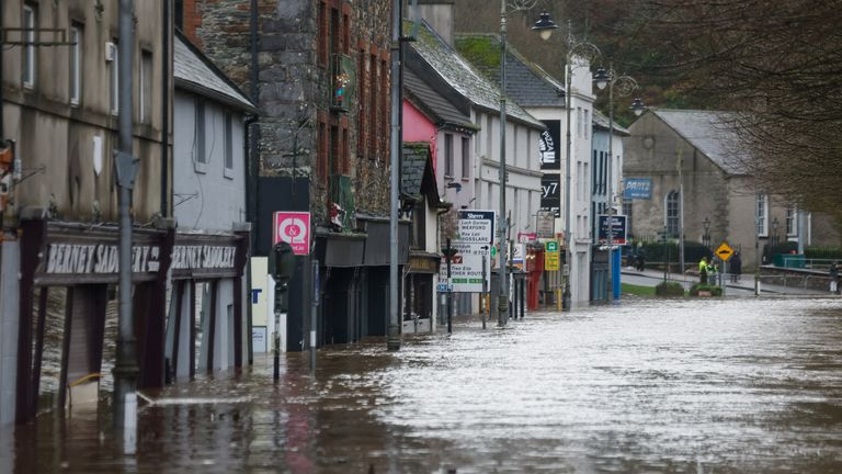 Floodwater flows through a street, after the River Slaney burst its banks during Storm Chandra, in Enniscorthy, County Wexford, Ireland, Jan