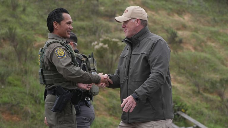 Homan greeting a US Border Patrol agent in 2025. Pic: AP