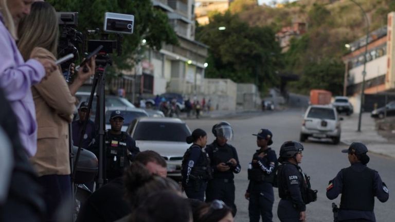 People wait for news about the release of their loved ones from El Helicoide