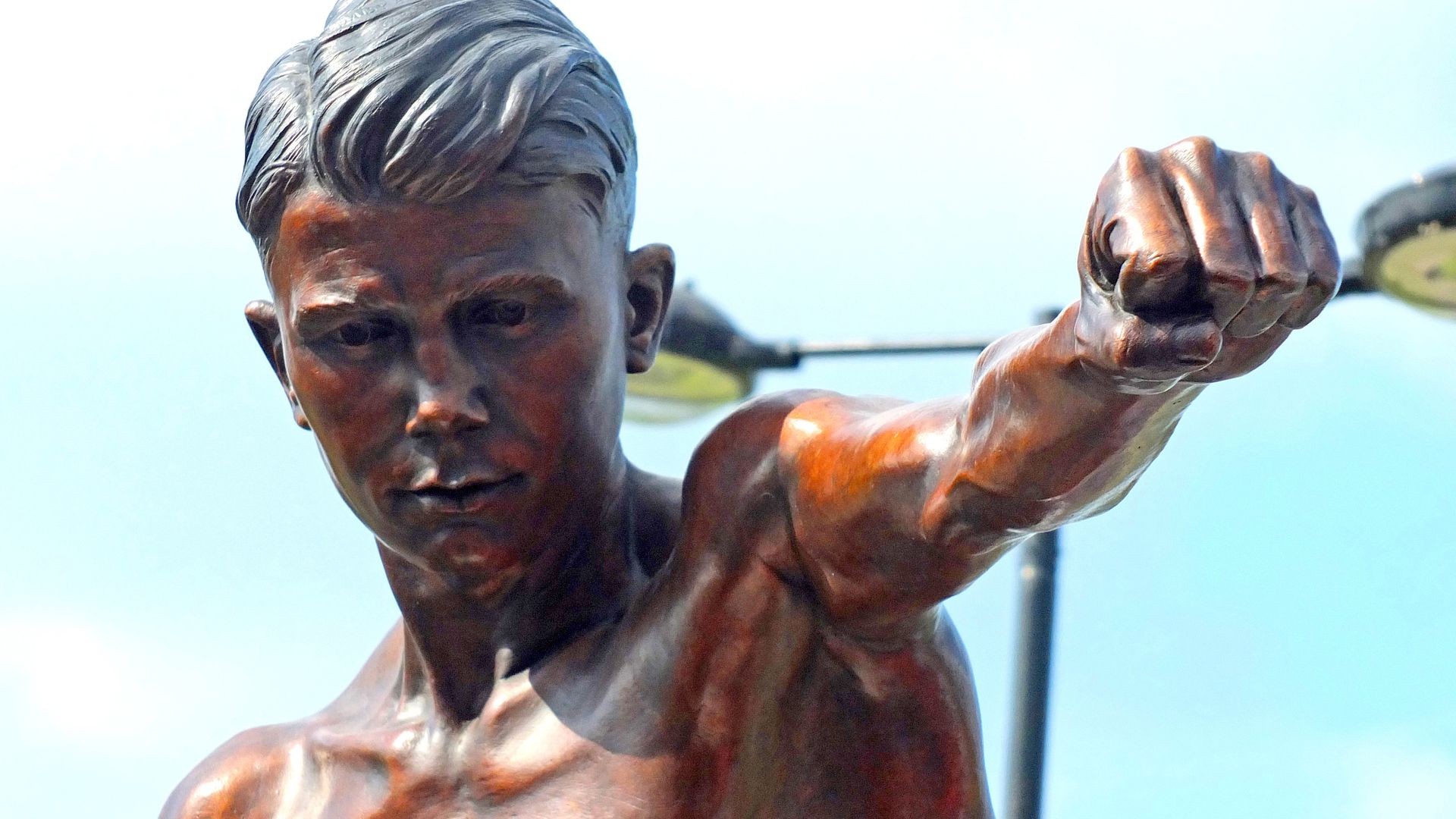 Masked men steal statue of local hero boxer using three-wheel bike and hi-vis jacket