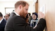 The Duke of Sussex writes a message of support during a visit to the National Centre for Rehabilitation of Addicts. Pic: PA