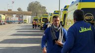 Egyptian ambulances wait before transporting into the Gaza Strip through the Rafah border crossing on the Egyptian side.
Pic: Reuters