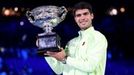 Spain's Carlos Alcaraz poses with the Norman Brookes Challenge Cup after defeating Serbia's Novak Djokovic in the men's singles final on Day
