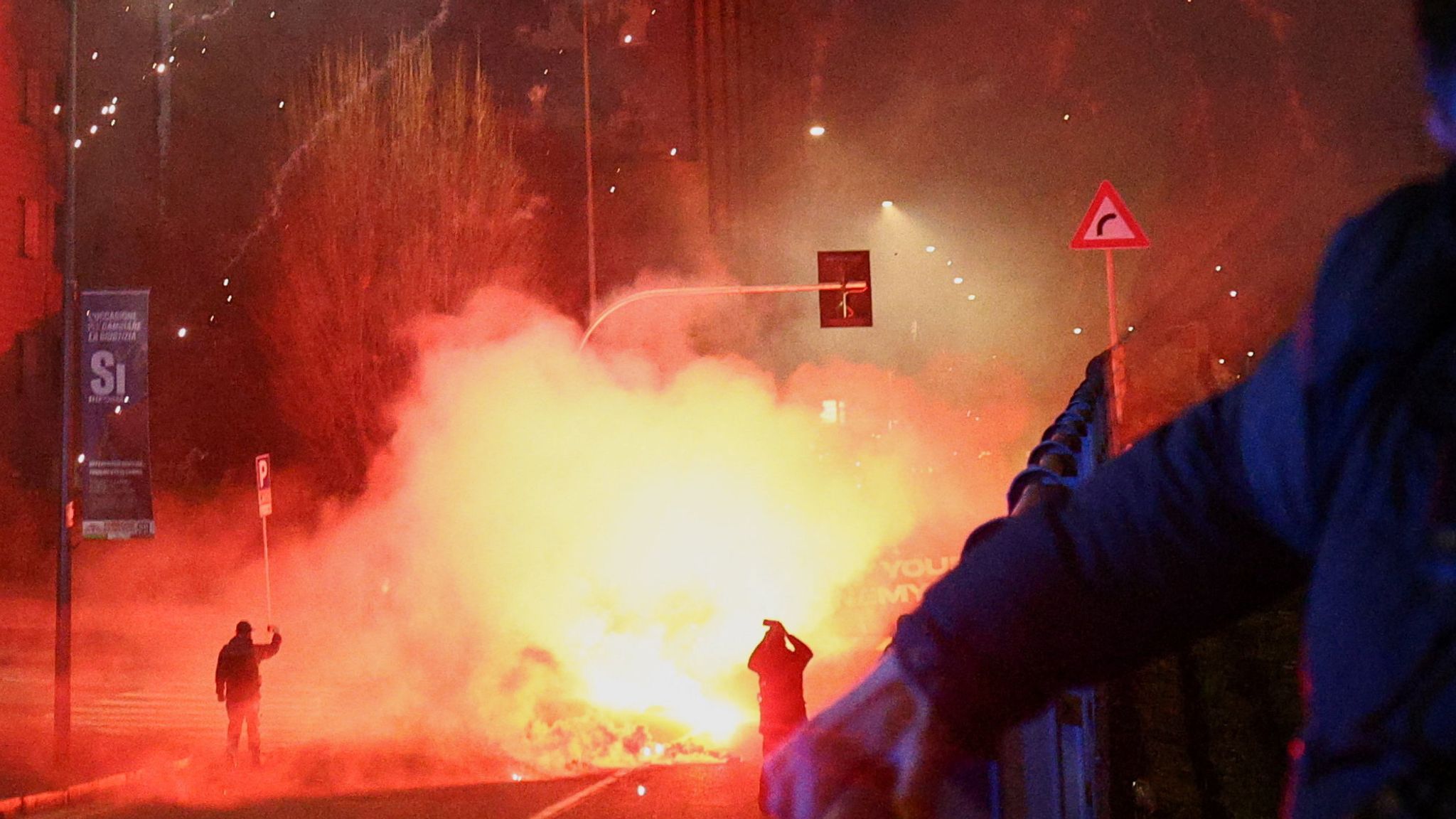 Italian police fire tear gas at protesters near Olympics venue | World News  | Sky News