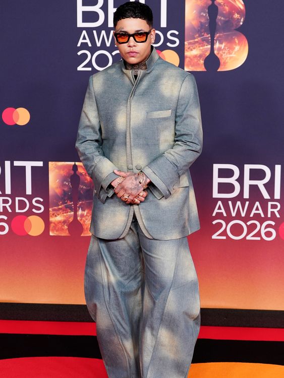 KWN in a tailored balloon-leg suit. Pic: PA