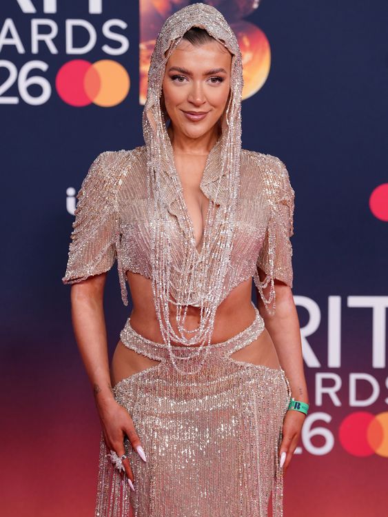 Love Islander Molly Marsh showing plenty of skin in a beaded top and skirt combo. Pic: PA