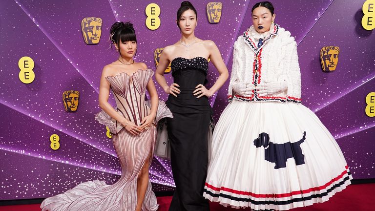 KPop Demon Hunters' Golden singers - Rei Ami, Ejae, and Audrey Nuna. Any outfit containing a dog goes straight to the top our best-dressed list. Pic: Ian West/ PA