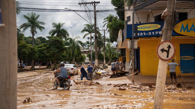 People were killed in the city of Uba after a river burst its banks and flooded central streets. Pic:dpa/AP Images
