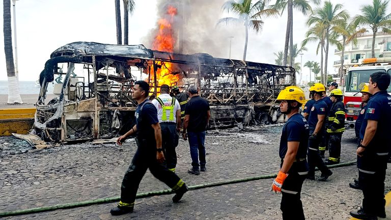 Firefighters at the scene of an arson attack in Puerto Vallarta. Pic: Reuters