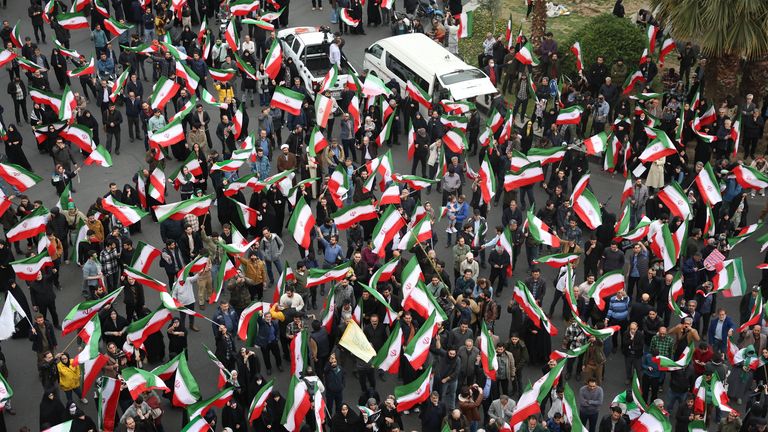 A group of demonstrators wave Iranian flags in support of the government in Tehran. Pic AP Photo/Vahid Salemi