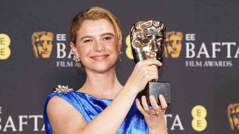 Jessie Buckley poses with the Leading Actress Award for her role in Hamnet. Pic: PA 