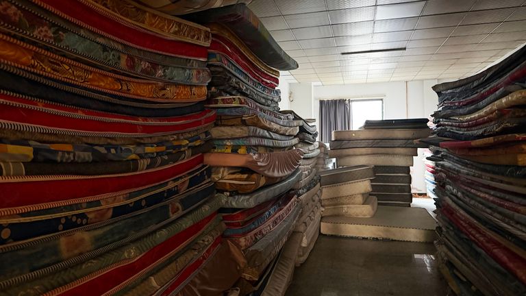 Mattresses are stacked up in the abandoned scam centre