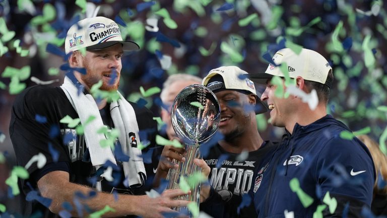 Seattle Seahawks head coach Mike MacDonald (right) and quarterback Sam Darnold (left) hold the Lombardi Trophy. Pic: AP