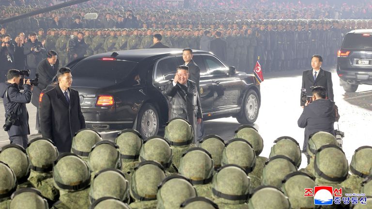Kim Jong Un gives a thumbs-up to troops during a military parade to commemorate the Ninth Congress.
Pic: KCNA/Reuters