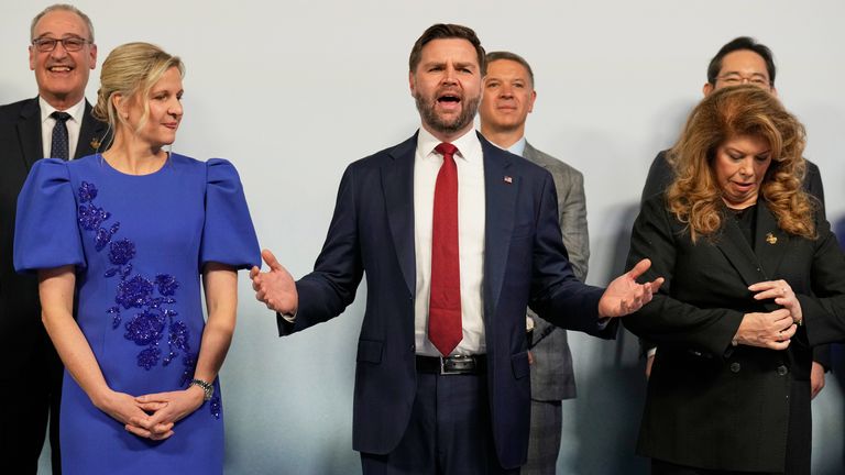 IOC President Kirsty Coventry looks at Vice President JD Vance, as they pose for a group photo at the heads of states dinner. Pic: AP

