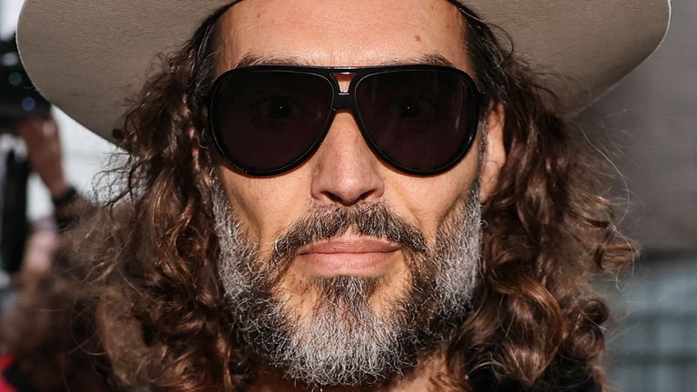 Russell Brand outside court earlier this year. Pic:  Reuters